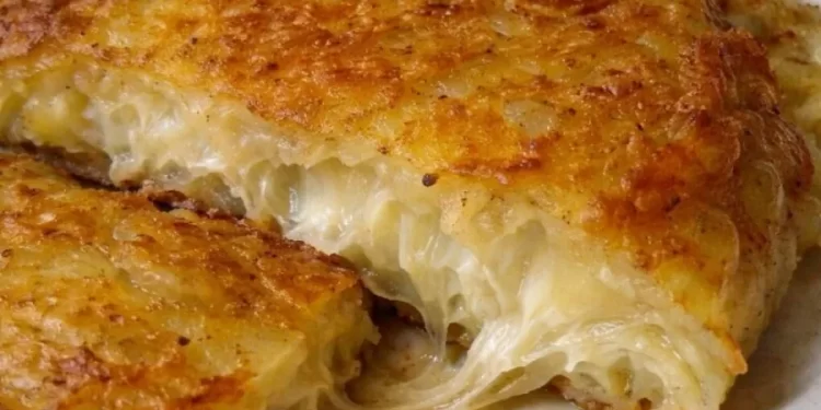 Πατάτες στον τρίφτη με λιωμένο τυρί